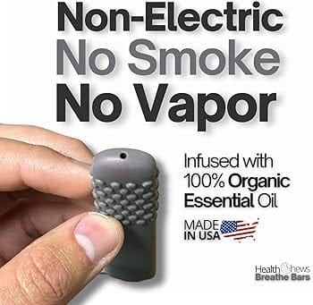 A hand holding a vape juice bottle with its ingredients label clearly visible, emphasizing the importance of reading product information for health and safety.