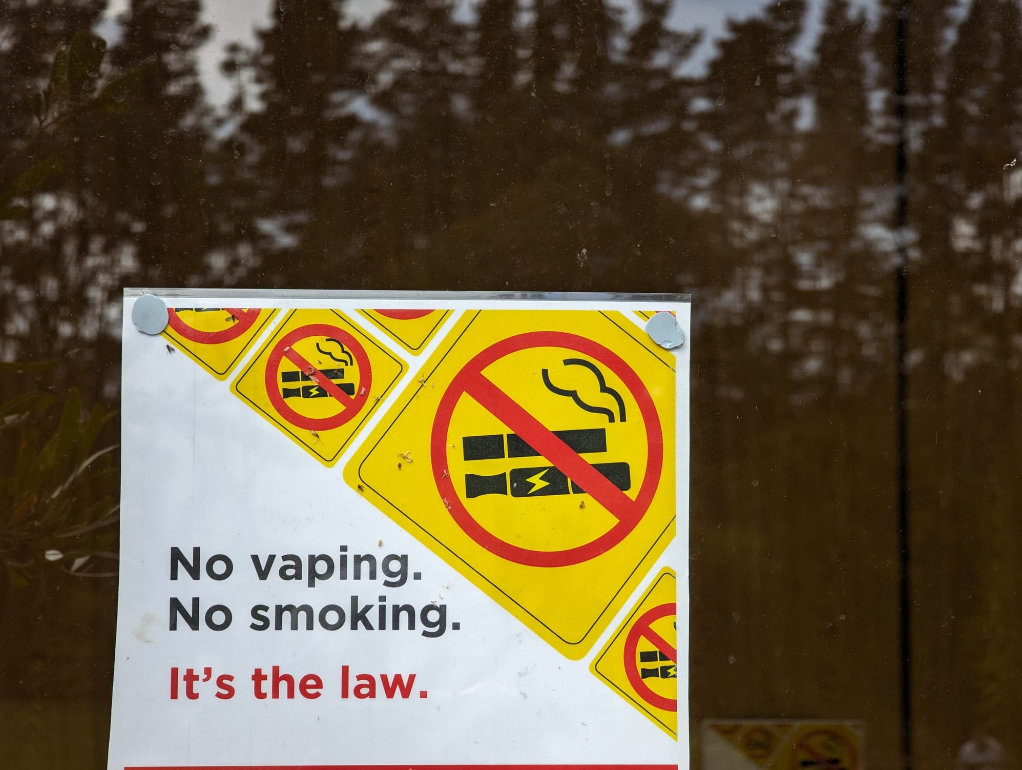 Australian Border Force officers inspecting shipping containers or packages, uncovering large quantities of smuggled disposable vapes, illustrating efforts against the black market.