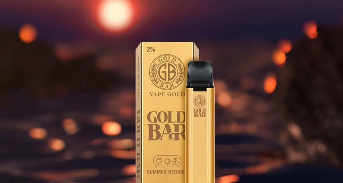 A close-up of the Alibarbar Ingot 9000 disposable vape, designed to resemble a sleek gold bullion bar, with its modern LED display screen visible.