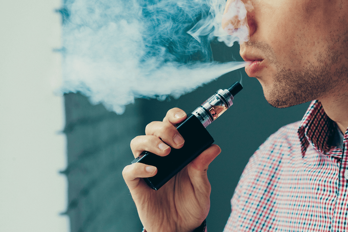 Close-up of genuine vape packaging showing crisp printing, brand logo, and holographic security elements for authenticity.