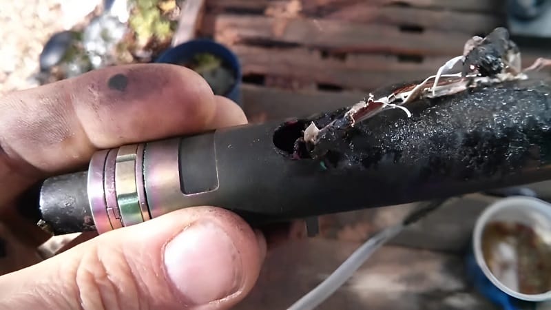 A damaged vape device lying on a floor, potentially cracked or dirty, emphasizing the need for inspection.